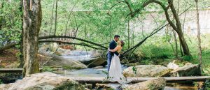 bride and groom kissing at summer camp wedding