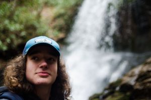 boy at waterfall