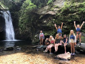 cabin of girls at waterfall