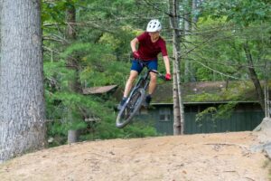 boy jumping mountain bike