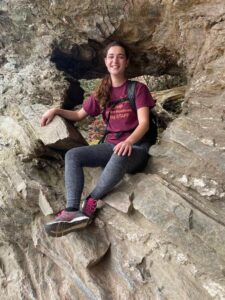 girl sitting on rock