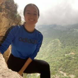 girl hiking rock