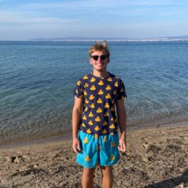 boy in front of ocean