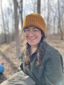 girl with beanie in woods