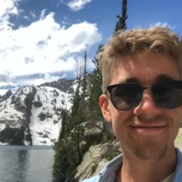 man hiking with mountain