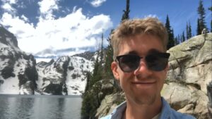 man hiking with mountain
