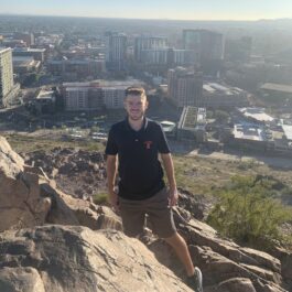 man on hike cityscape