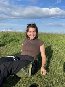 girl sitting in field