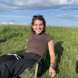 girl sitting in field