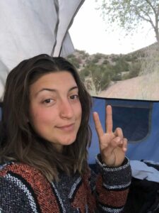 girl camping in desert